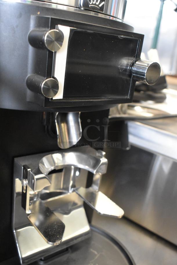Brand new 2025 Mahlkonig E65W GBS espresso grinder, black, 2.6 lb. capacity, visible minor scratches, 110-127V, 1 Phase.