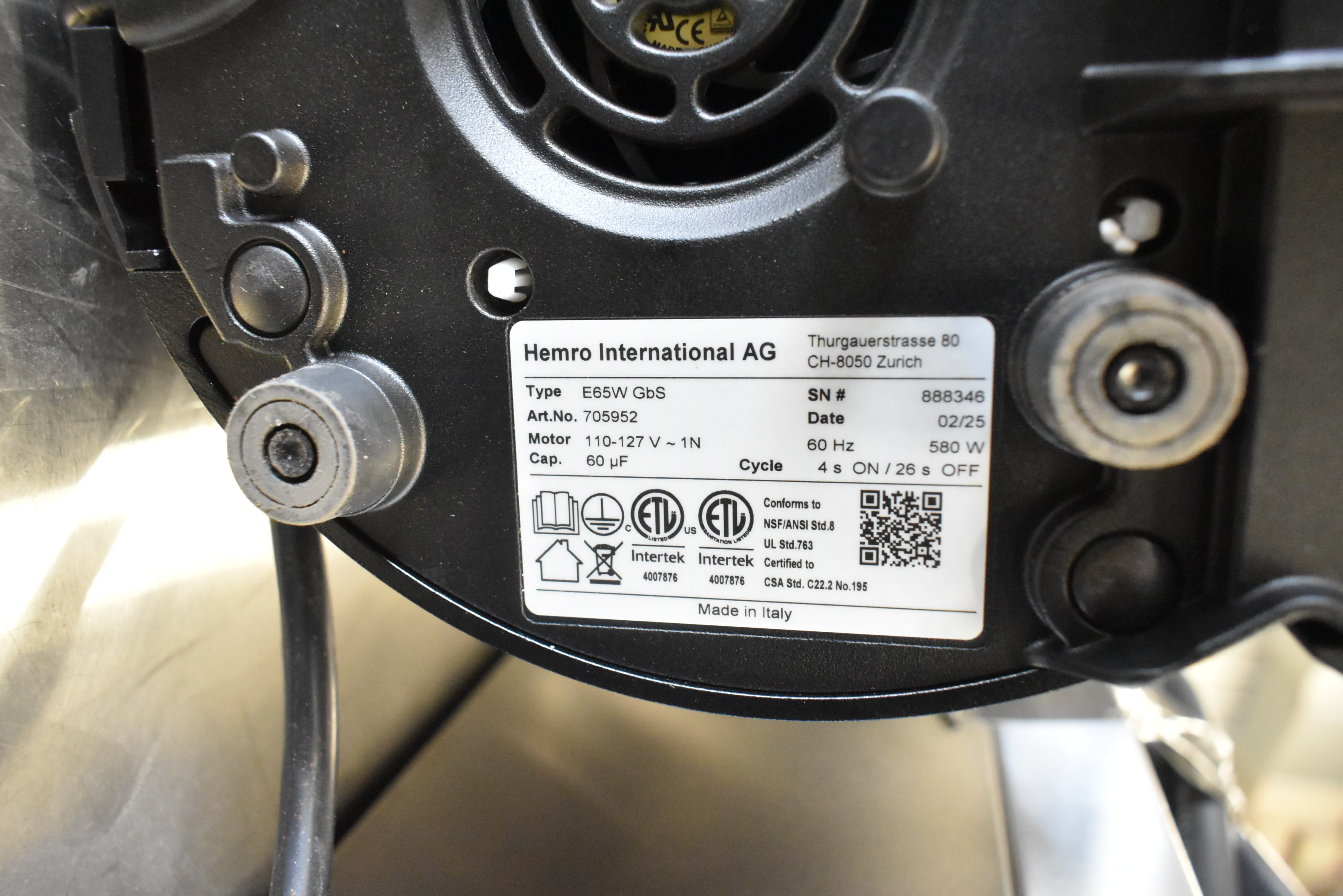 Commercial coffee grinder specification plate showing model and electrical requirements