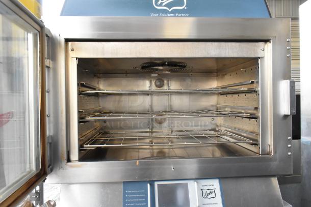 Duke TSC-6/18 stainless steel electric oven proofer, 208V, 3 phase, with commercial casters. Open door showing interior racks.