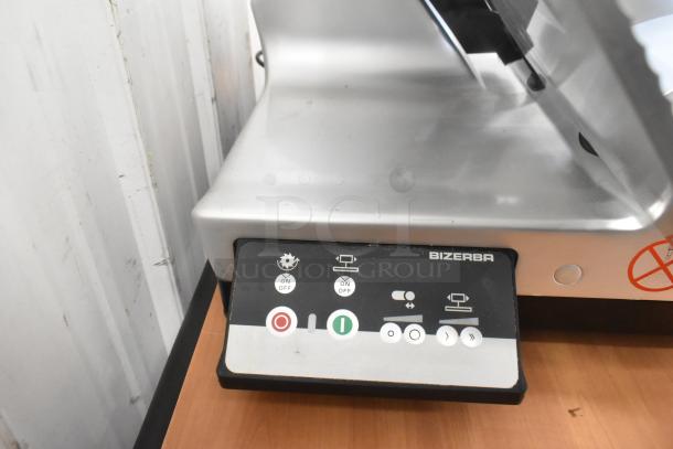 2023 Bizerba GSP HD commercial meat slicer, 115 volts, 1 phase, control panel with on/off buttons and slicing options.