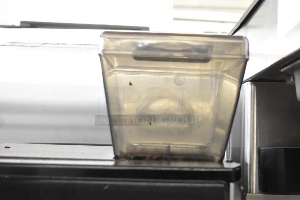 Bunn Crescendo stainless steel commercial coffee brewer, bean hopper view, showing used condition. Model 44300.0201.