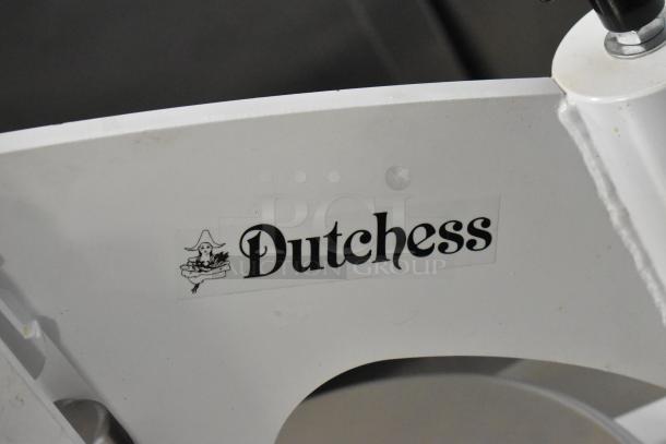 Dutchess DoughXpress DMS-18 NH dough press with logo. Appears in good condition on a metal pan rack with casters.