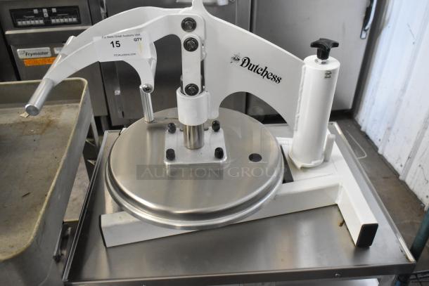 Dutchess DoughXpress DMS-18 NH metal dough press on metal pan rack with commercial casters. Model tag visible.