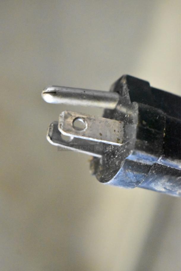 Close-up of a plug from the Superior SPGM1 Stainless Steel Commercial Countertop Panini Press. 120 Volts, 1 Phase.