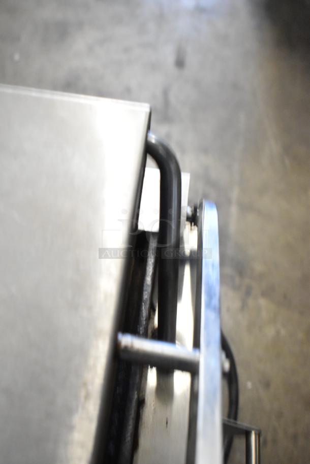 Superior SPGM1 stainless steel commercial countertop panini press, showing the durable metal exterior. 120 volts, 1 phase.