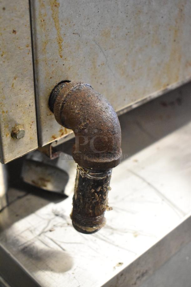 Cook Rite stainless steel commercial charbroiler, natural gas powered, showing a rusted gas pipe connection, used condition.