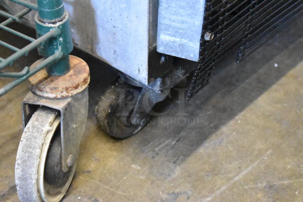 True T-23F stainless steel commercial freezer on casters, detail of wheels and base. 115 volts, single phase.