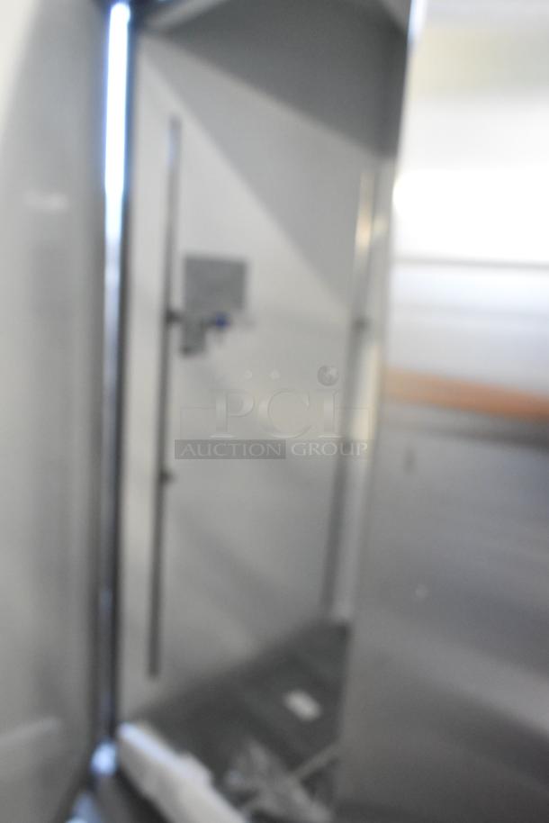 Brand new Mainstreet 829BMR49F stainless steel 2-door reach-in freezer with poly coated racks, 115V, 1 phase, slight scratches.