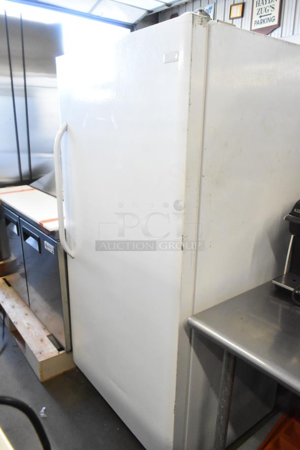 Frigidaire FFRU17B2QWE single door reach-in cooler, metal exterior, 115 volts, 1 phase, visible wear, spacious interior.