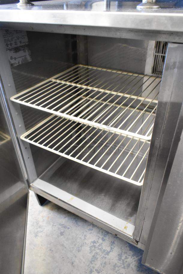 Duke RUF-48M stainless steel 2-door undercounter cooler, commercial grade, 120V, 1 phase, interior wired shelves visible.