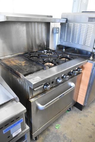 Cook Rite stainless steel commercial gas-powered range with 4 burners, flat top griddle, oven, over shelf, and back splash.