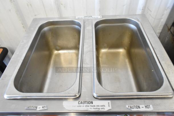 Duke CSW-2-T-AM stainless steel countertop 2-well food warmer, 120V, 1 phase. Features caution labels. Good condition.