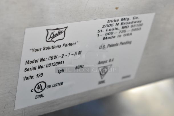 Duke CSW-2-T-AM stainless steel commercial 2-well food warmer tag. Model: CSW-2-T-AM, 120V, 1 Phase. UL listed.