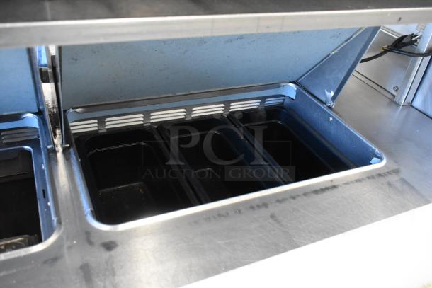 Delfield stainless steel commercial prep table with bain marie, mega top, 4 drawers, and overhead shelf; 115V, 1 phase.