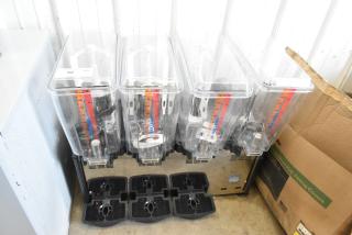 Carnival King 382RBD5G4 stainless steel quadruple 5-gallon beverage dispenser, brand new, minor scratches and dents.