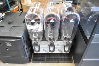 Brand new Narvon 378RBD5G3 stainless steel triple 5-gallon beverage dispenser, 115V, scratch and dent condition, tags visible.