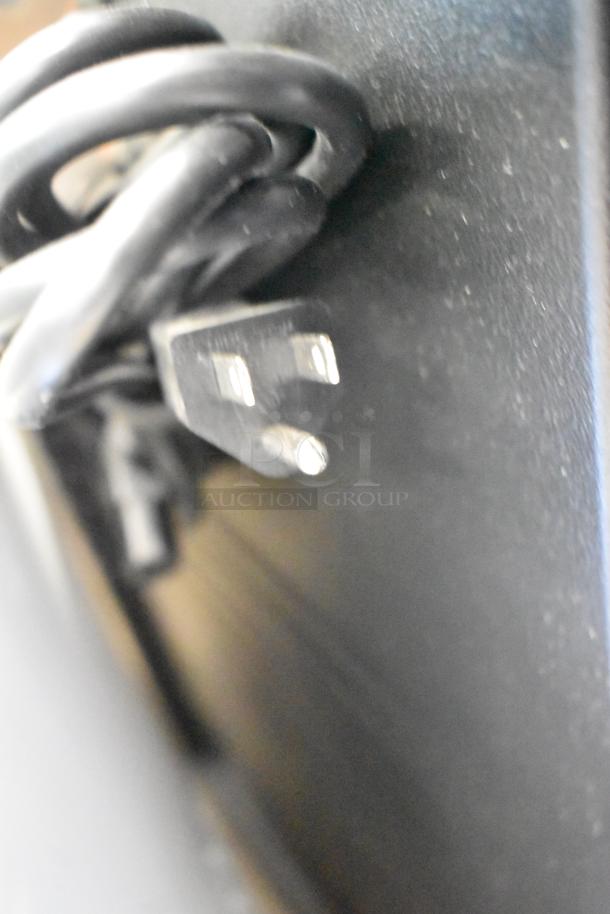Brand new Cambro CAM6000 gray poly heated holding case. Slight scratches and dents. 120V, 1 phase power cord visible.