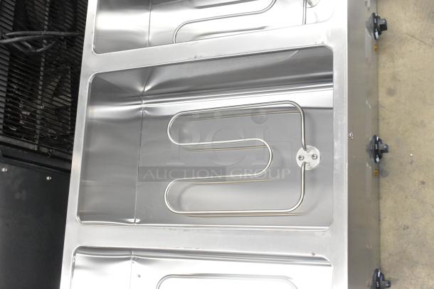 Brand new Avantco 177STE3S stainless steel three-pan electric steam table with visible heating element, 120V, 1 phase.