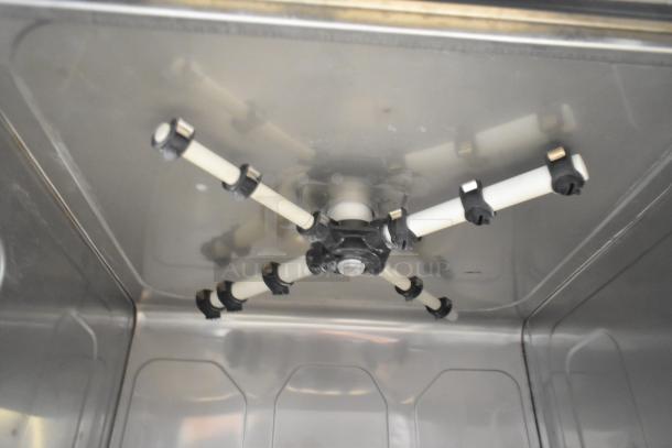 Brand new 2025 Noble 495HTGW22 stainless steel commercial underbar glass washer interior, showing spray arm assembly.