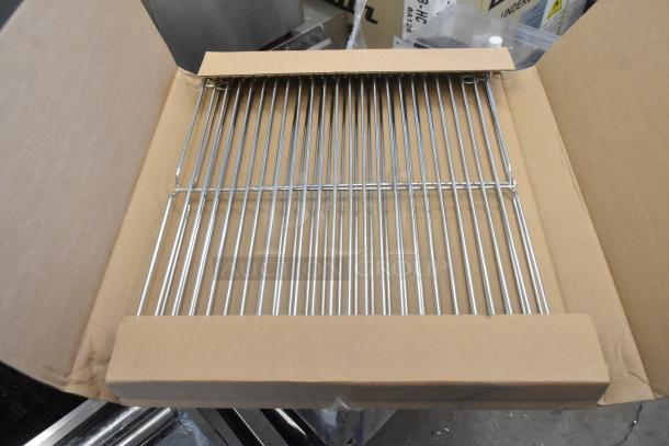 Stainless steel rack for Cleveland 22CET6.1 SteamChef steamer, shown in open cardboard box, brand new condition.
