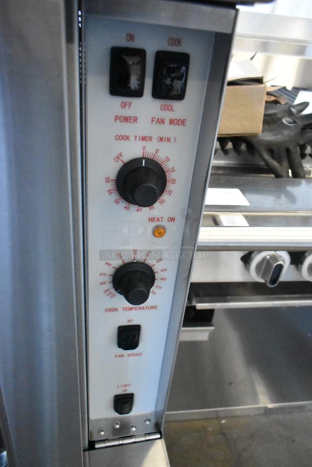 Cooking Performance Group FEC-100-C convection oven controls, stainless steel, thermostatic knobs, fan speed, light.