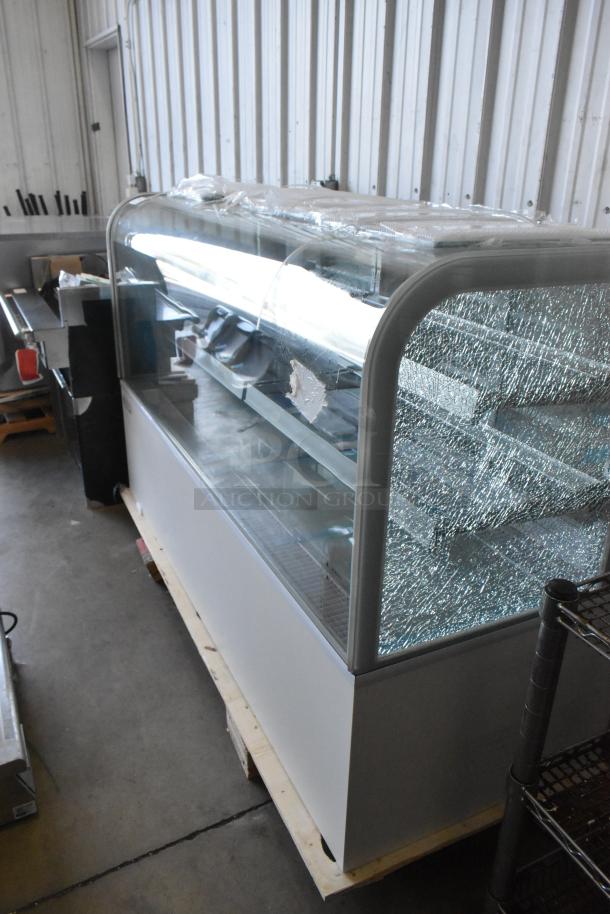 Brand new Avantco 193BC72HCW 72" white refrigerated display case with curved glass. Notable scratches and broken glass.