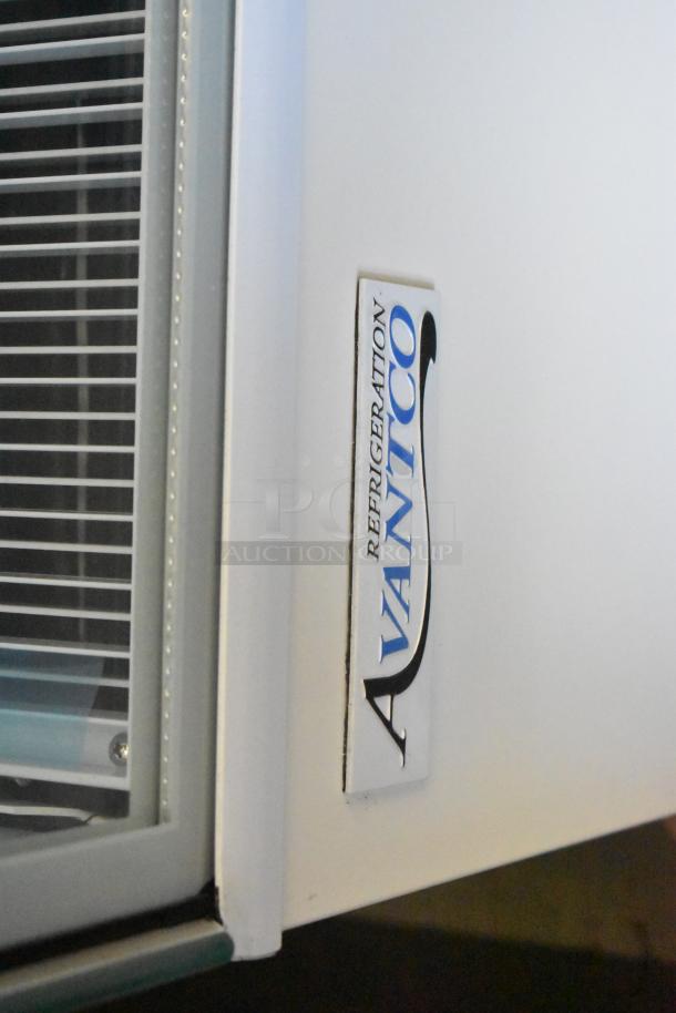 Avantco 193BC72HCW refrigerated bakery display case, 72" with curved glass, minor glass damage, brand label visible.