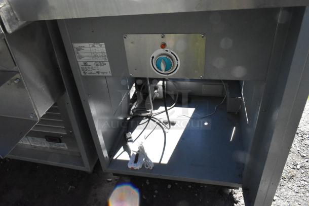 Duke stainless steel commercial sandwich prep line with lowering sneeze guard, 120V, 1 phase, showing interior components.