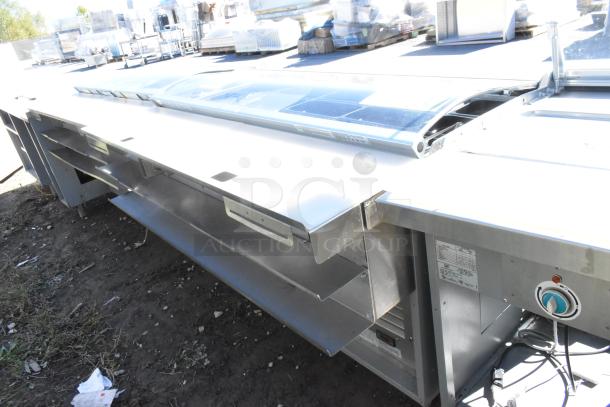 Duke stainless steel commercial sandwich prep line with lowering sneeze guard, 120V, 1 Phase. Tags show specifications and model details.