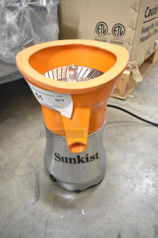Brand new Sunkist PJF-A12959 black Pro Series citrus juicer, 115 volts, 1 phase, with minor scratches, orange top.