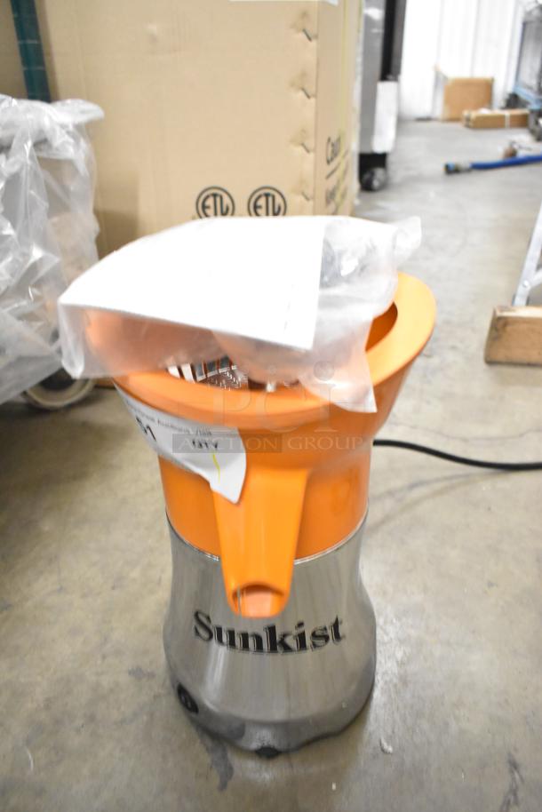 Brand new Sunkist PJF-A12959 Pro Series Citrus Juicer, 115 Volts, 1 Phase, with scratches and dents, orange and black.