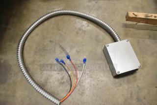 Brand new Delfield 000-282-00H9-S Assy, TSTAT Danfoss Service Kit with scratch and dent. Coiled metal conduit, wiring visible.