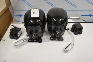 Two Cubigel NUT55NR and NUT70NR compressors, brand new, scratch and dent, 115-127 volts, 1 phase, with accessories.