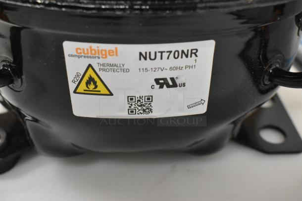 Cubigel NUT70NR compressor, brand new, thermally protected, 115-127V, 1 phase, includes warning label and QR code.