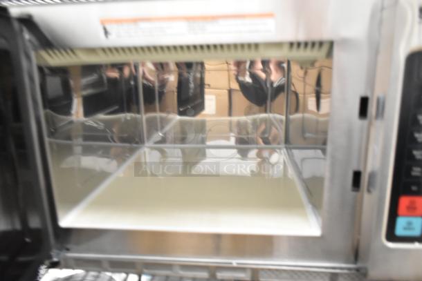 Solwave stainless steel commercial microwave oven, brand new, scratch and dent condition, interior view, visible controls.