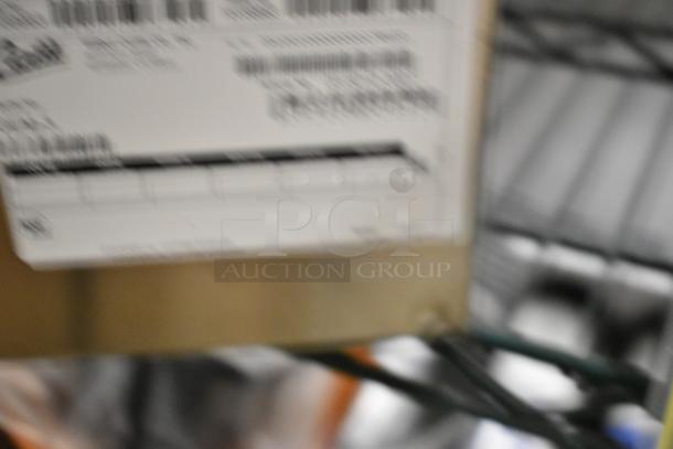 Blurred image of a label on a Bunn GEM-3 1.5 Gallon Satellite Coffee Server, described as brand new with scratches and dents.