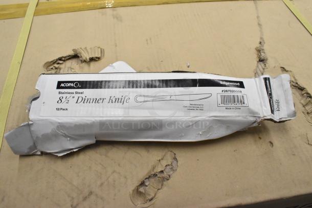 Box of Acopa Edgewood 8 1/2" stainless steel dinner knives, 12 per case. New, scratch and dent condition. Item #267320008.