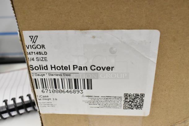 "Vigor 24714SLD 1/4 Size Solid Stainless Steel Pan Cover packaging, labeled as new, with barcode and warning info visible."