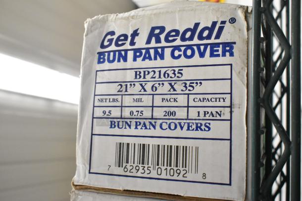 Two boxes of Inteplast Group BP21635 bun pan covers, 21"x6"x35", scratch and dent condition, 200 covers per box.