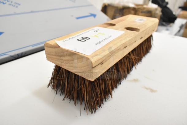 10" Palmyra Deck Scrub brush, new, wood block, dense bristles, item #3619200, minor scratches. Tag displays auction details.