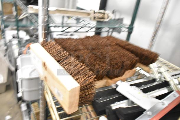 5 brand new 10" Palmyra deck scrub brushes, item #3619200, with scratch and dent imperfections on display.