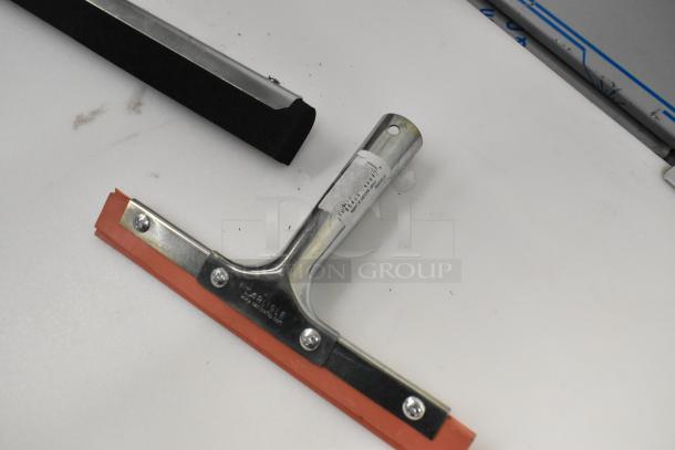 Seven new scratch and dent squeegee heads, including models 36632400 and 27140072, with visible metal handles and rubber blades.