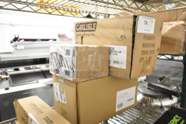 Three new Carlisle steam table pans in scratch and dent boxes; includes 1/3 size, 24 gauge, anti-jam pans.