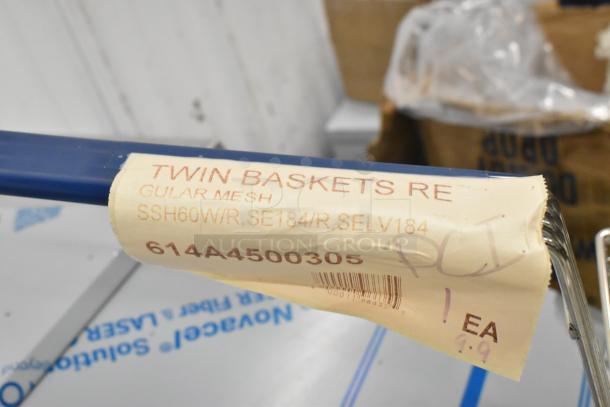 Twin fryer basket with front hook, labeled "614A4500305," made of durable metal, shown in brand new condition.