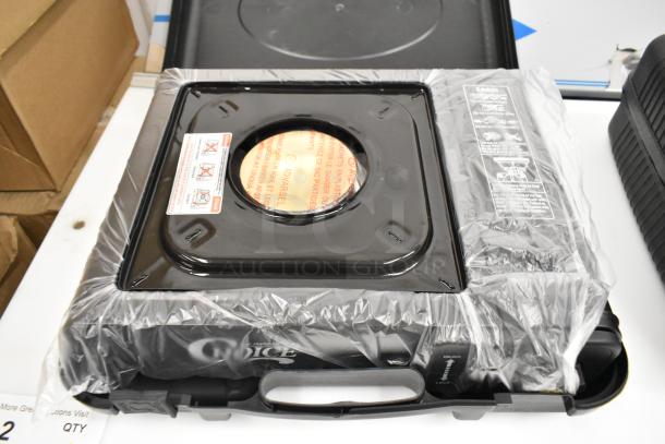 Brand new Choice 1-Burner butane range, 15,000 BTU, portable stove with brass burner, in packaging, clear safety label visible.