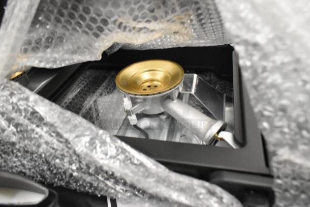 Brand new Choice 1-burner and 2-burner butane ranges with brass burners, partially wrapped in bubble wrap.