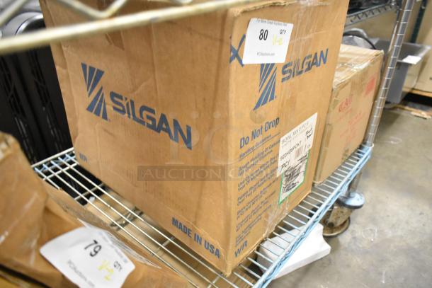 Cardboard boxes containing new scratch and dent Vollrath 8-piece mixing bowl set and CAC red oval platter set.