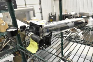 BRAND NEW SCRATCH AND DENT! Pentair Everpure i2000 Water Filtration System on metal shelf, gauge visible, labeled cylinder.