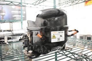 BRAND NEW Cubigel NUT70NR Compressor, 115-127V, 1 Phase. Minor scratches. Thermally protected, with safety and certification labels.