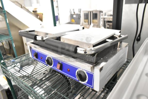 Globe Stainless Steel Commercial Double Panini Press, brand new, minor scratches and dents, dual temperature controls.